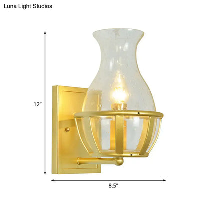 Gold Clear Glass Wall Lamp sconce with hurricane glass shade and lantern cage by Decorbites on Tampa Home & Garden Store