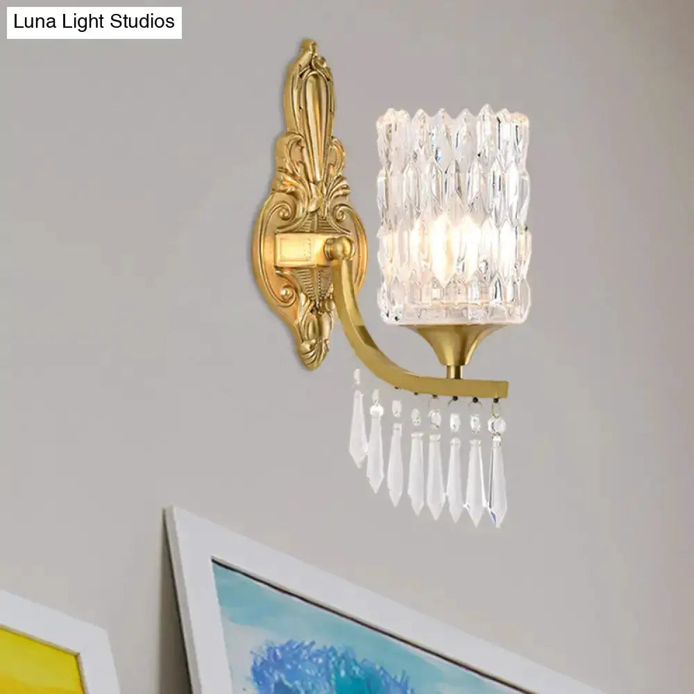 Postmodern gold column crystal wall lamp with crystal shade and hanging prisms on wall on Tampa Home & Garden Store