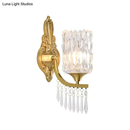Postmodern gold column crystal wall lamp with ornate backplate and hanging prisms on Tampa Home & Garden Store