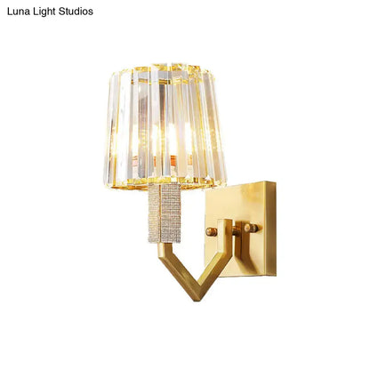 Gold crystal prism wall light sconce with a V-shaped arm and crystal shade by Decorbites on Tampa Home & Garden Store