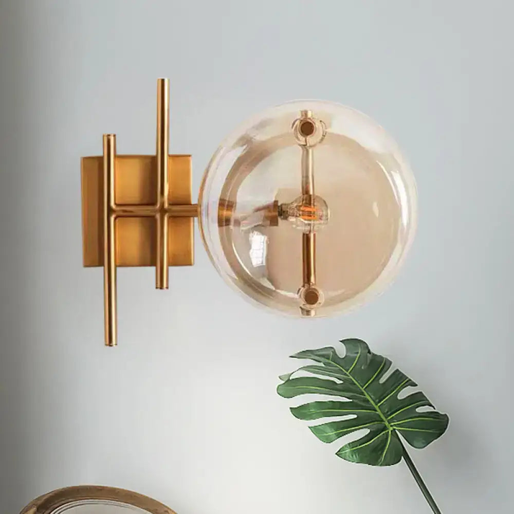 Gold double ball glass sconce by Decorbites with brass finish and clear glass globe on Tampa Home & Garden Store