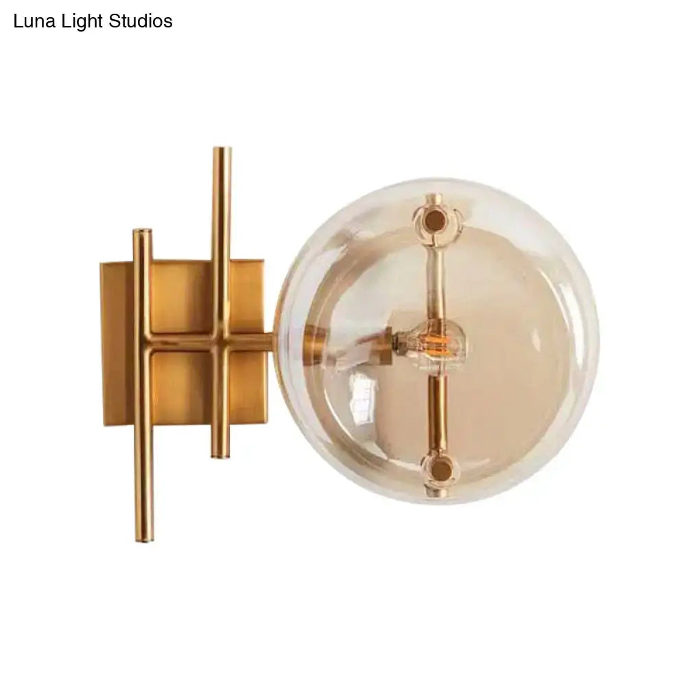 Gold double ball glass sconce wall light with a clear globe and brass finish on Tampa Home & Garden Store