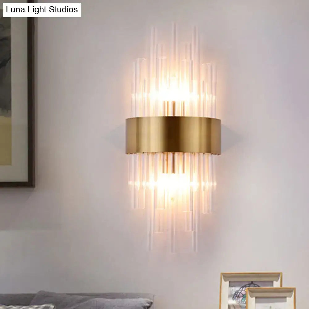 Gold fluted crystal wall sconce with vertical crystal rods and brass band warm glow on Tampa Home & Garden Store