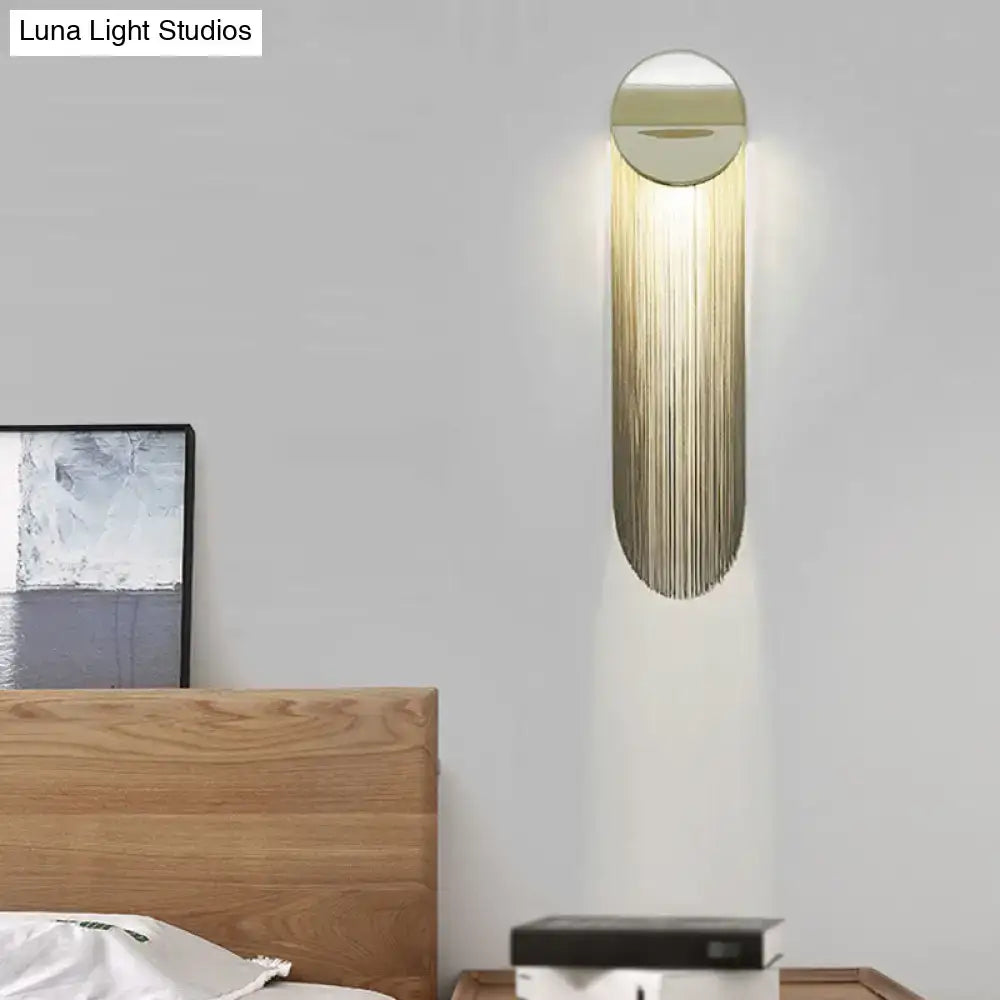 Gold Fringed Wall Sconce with shimmering gold fringe on round metal mount on Tampa Home & Garden Store