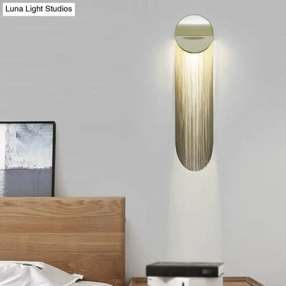 Gold Fringed Wall Sconce with shimmering gold fringe on round metal mount on Tampa Home & Garden Store
