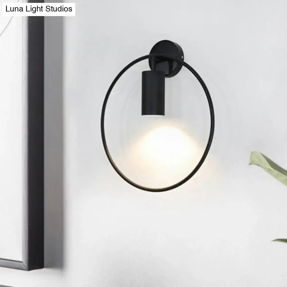 Gold halo ring wall sconce by Decorbites, black metal circular halo with light on wall on Tampa Home & Garden Store