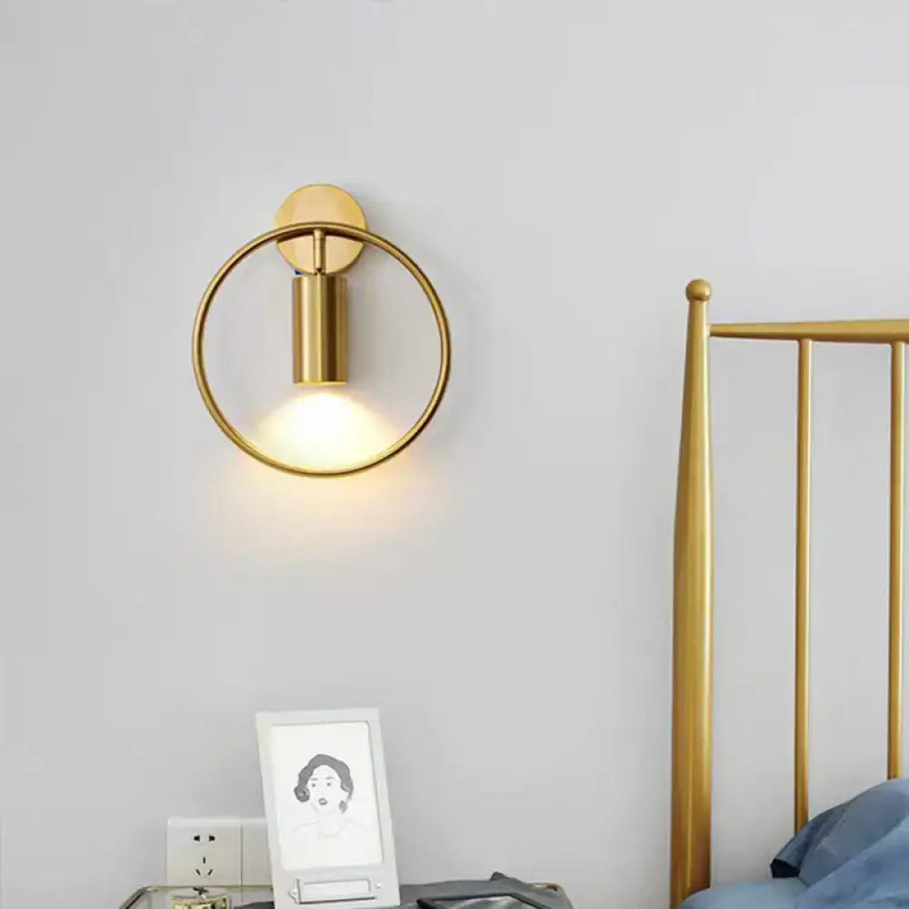 Gold Halo Ring Wall Sconce with circular halo frame and cylindrical light by Decorbites on Tampa Home & Garden Store