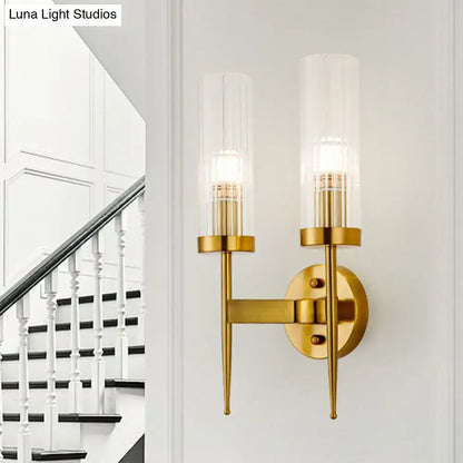 Decorbites gold ribbed glass stairway dual-light wall sconce with brass finish and twin cylindrical shades on Tampa Home & Garden Store