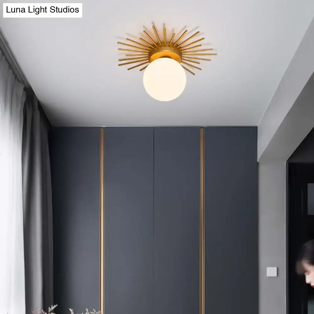 Gold sunburst ceiling light by Decorbites, flush-mount with glass globe in modern gray room on Tampa Home & Garden Store