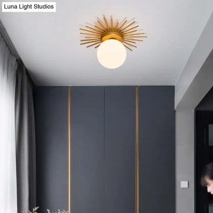 Gold sunburst ceiling light by Decorbites, flush-mount with glass globe in modern gray room on Tampa Home & Garden Store
