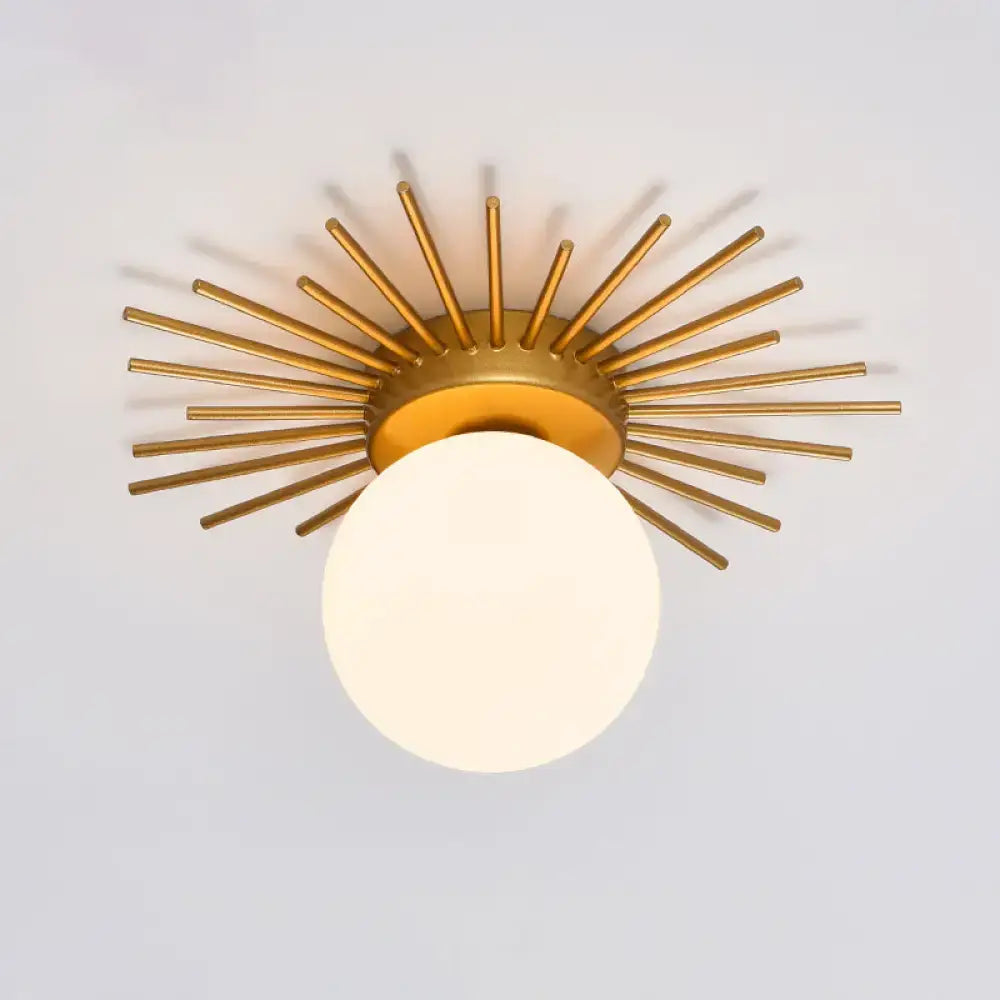 Gold sunburst ceiling light flush mount by Decorbites with white glass globe on Tampa Home & Garden Store