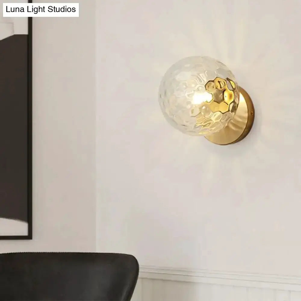 Postmodern gold textured glass ball wall sconce with brass base for stairway lighting on Tampa Home & Garden Store
