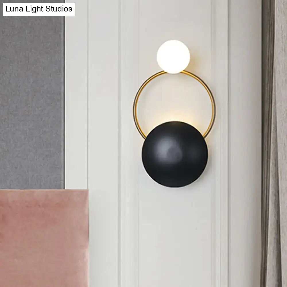 Decorbites Black Gold Orb Wall Sconce with white top globe, gold ring, and black orb on Tampa Home & Garden Store