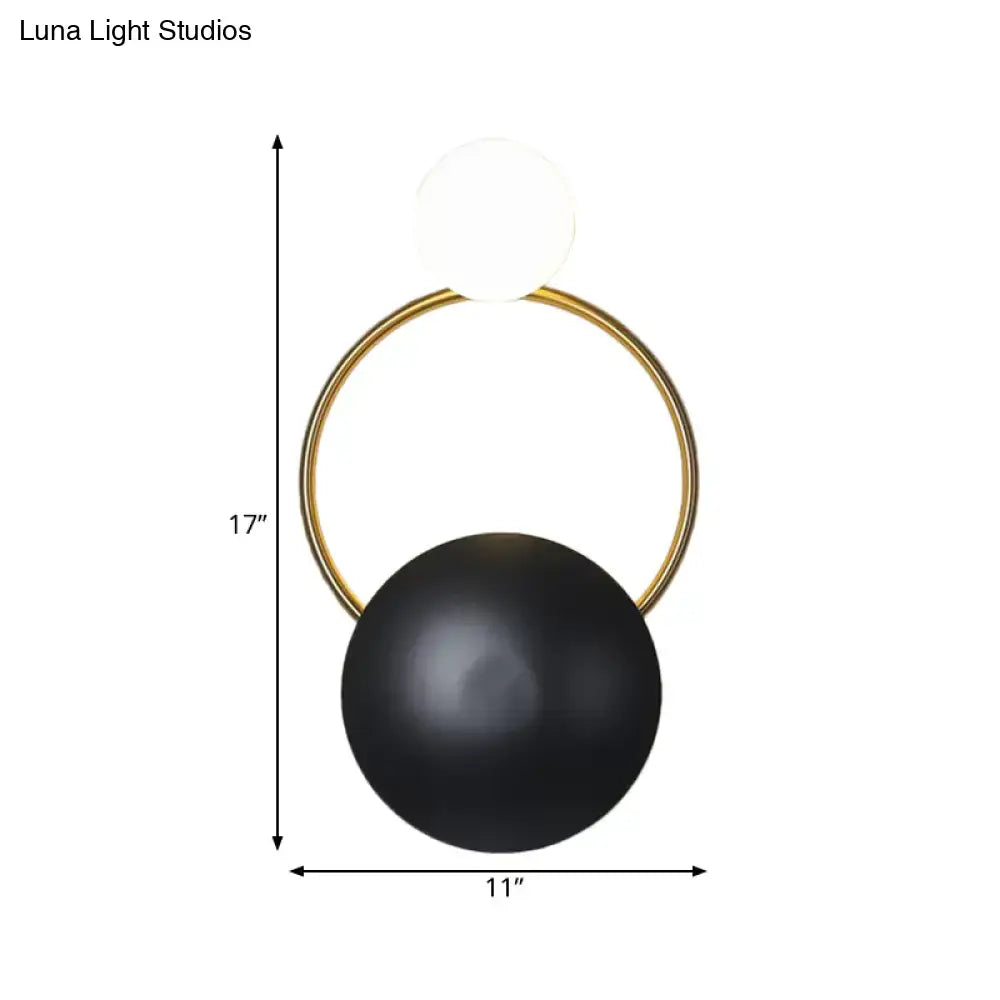 Black orb wall sconce with gold ring and white glass top by Decorbites on Tampa Home & Garden Store