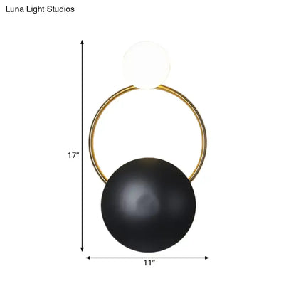 Black orb wall sconce with gold ring and white glass top by Decorbites on Tampa Home & Garden Store