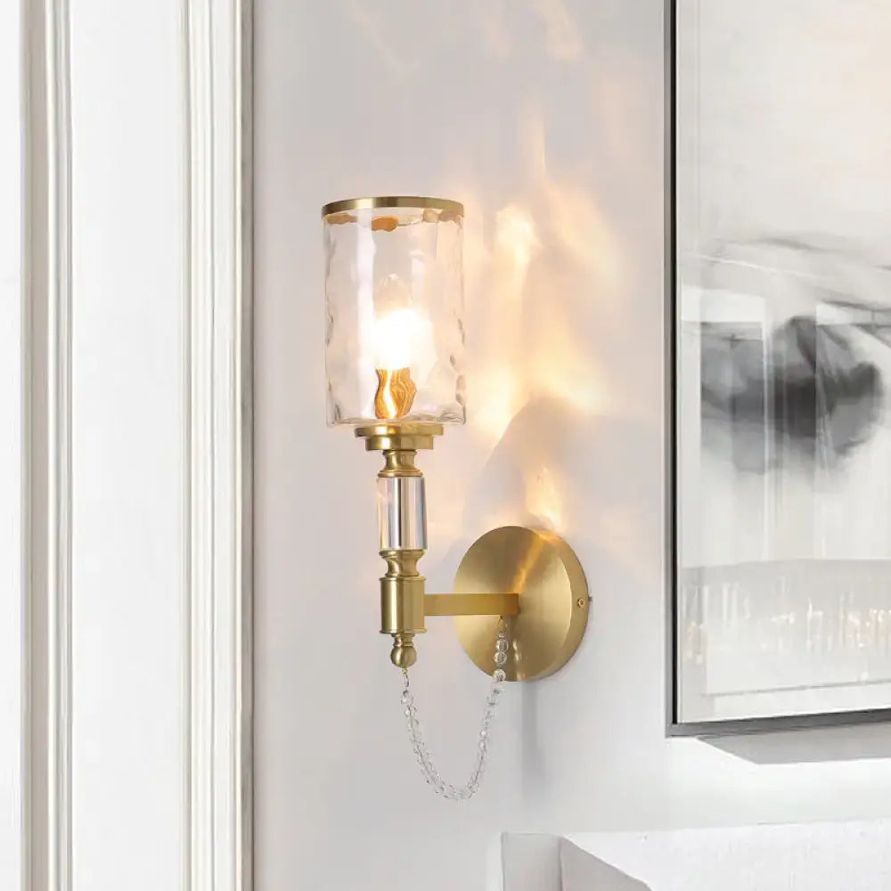 Decorbites brass crystal wall sconce with glass shade and chain accent on Tampa Home & Garden Store