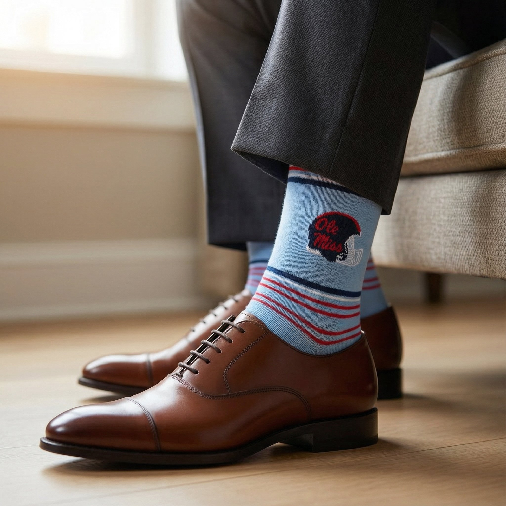 Powder Ole Miss Helmet Dress Socks by DeadSoxy in light blue with helmet logo and striped cuff on Tampa Home & Garden Store