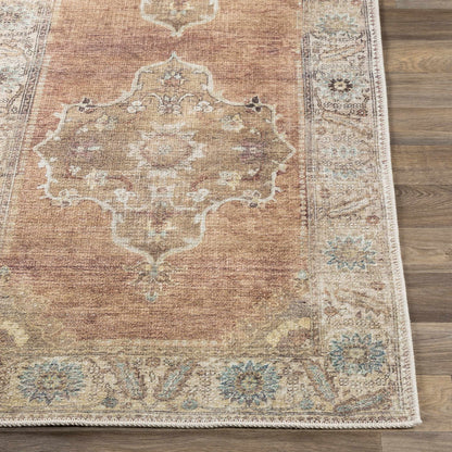 Powhatan Washable Area Rug rust with ornate medallion border by Boutique Rugs on wood floor on Tampa Home & Garden Store