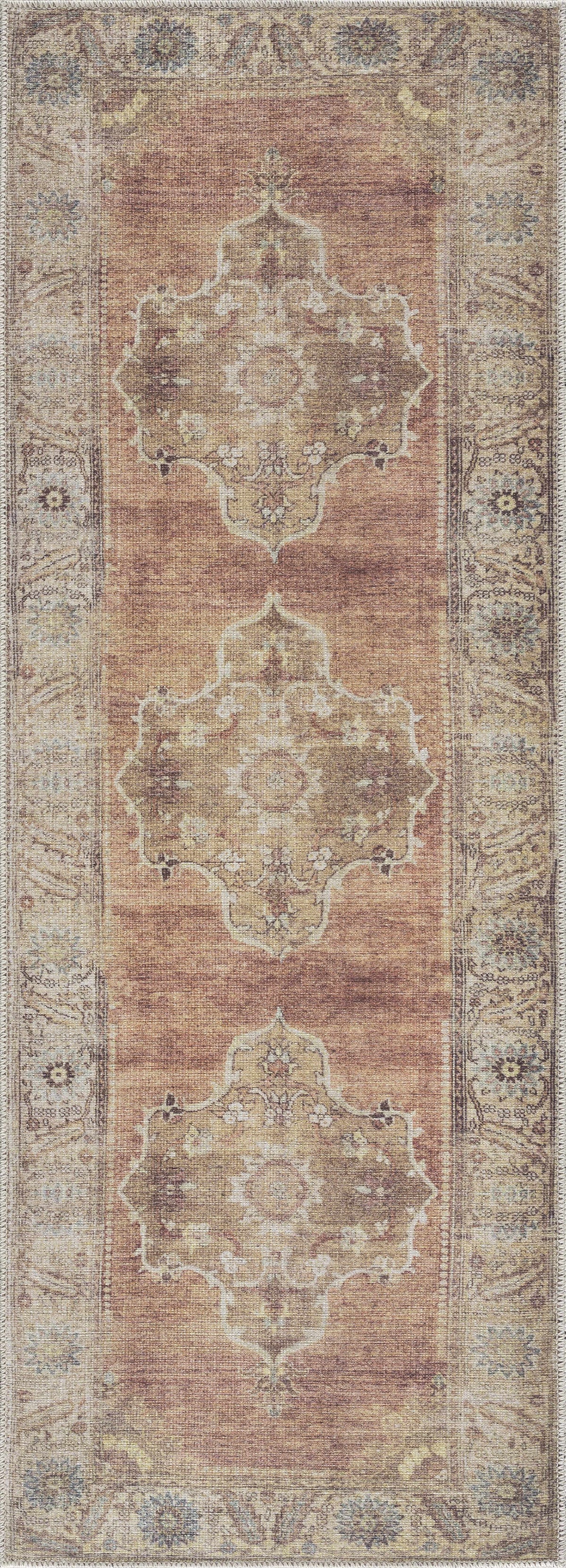Powhatan washable area rug by Boutique Rugs in warm rust and beige with ornate medallions on Tampa Home & Garden Store