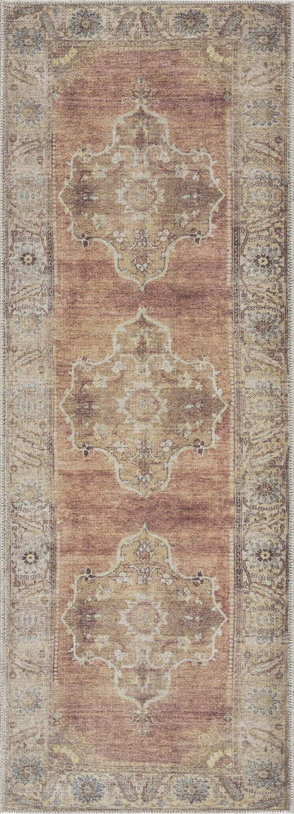 Powhatan washable area rug by Boutique Rugs in warm rust and beige with ornate medallions on Tampa Home & Garden Store