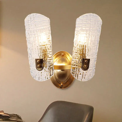Gold prism glass sconce with two textured glass shades in a brass finish by Decorbites on Tampa Home & Garden Store
