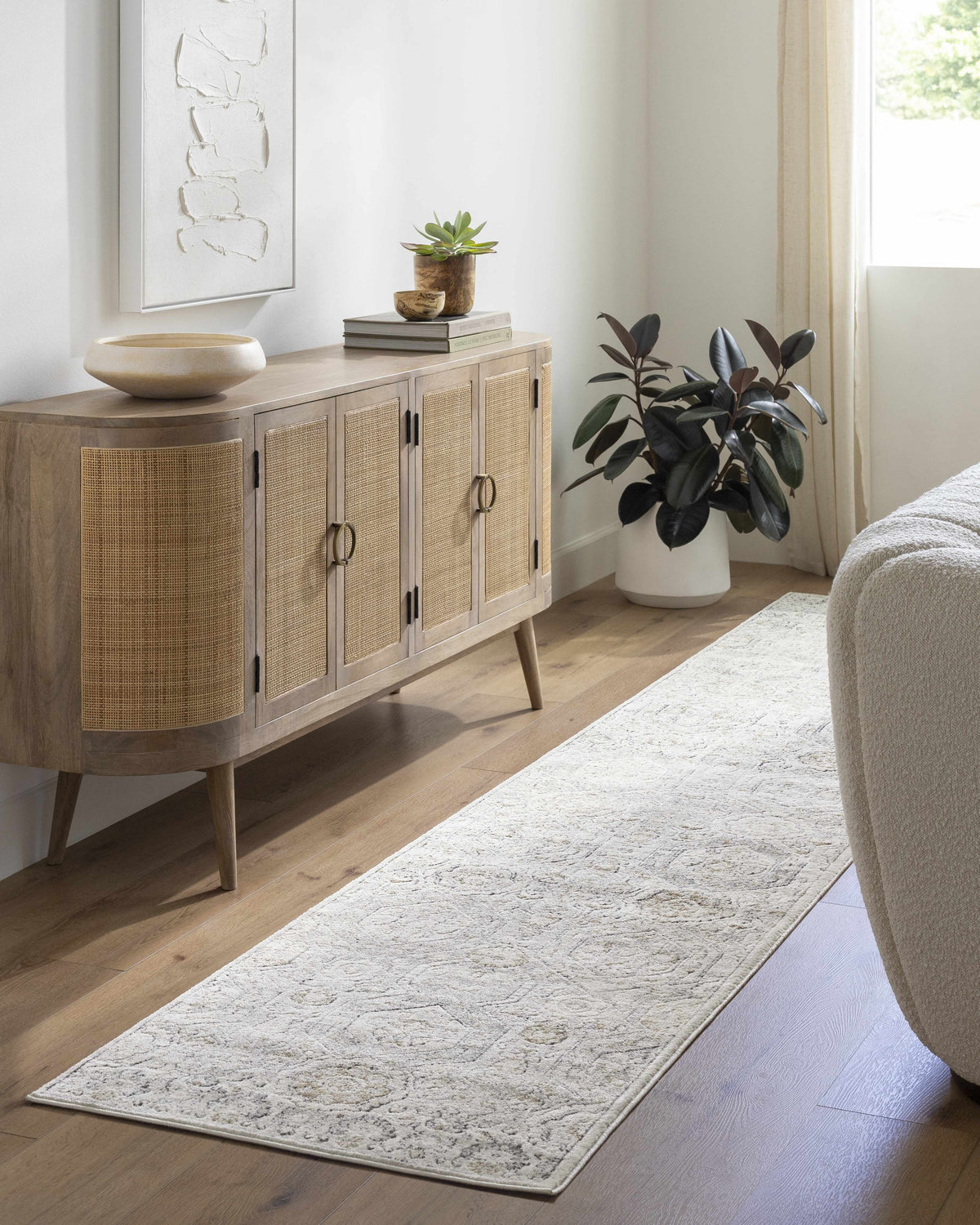 Parkerfield Area Rug, cream textured with subtle pattern in a neutral living room on Tampa Home & Garden Store