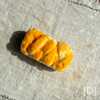 Artificial Bread & Pastry Display Prop orange glazed roll on linen backdrop RusticReach on Tampa Home & Garden Store
