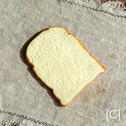 Artificial Bread & Pastry Display Prop slice in ivory with light crust on linen RusticReach 1 piece on Tampa Home & Garden Store