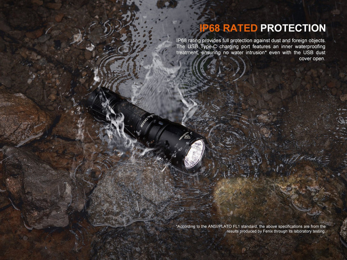 Fenix TK05R compact tactical flashlight IP68-rated black knurled body submerged in rocky water on Tampa Home & Garden Store