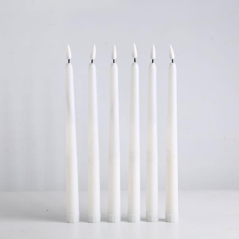 Six white plastic flameless LED taper candles with warm flicker on Tampa Home & Garden Store