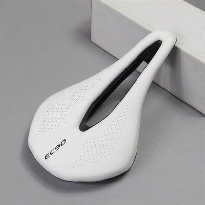 White sport bicycle saddle with central cutout and perforated top, black rail accents on Tampa Home & Garden Store