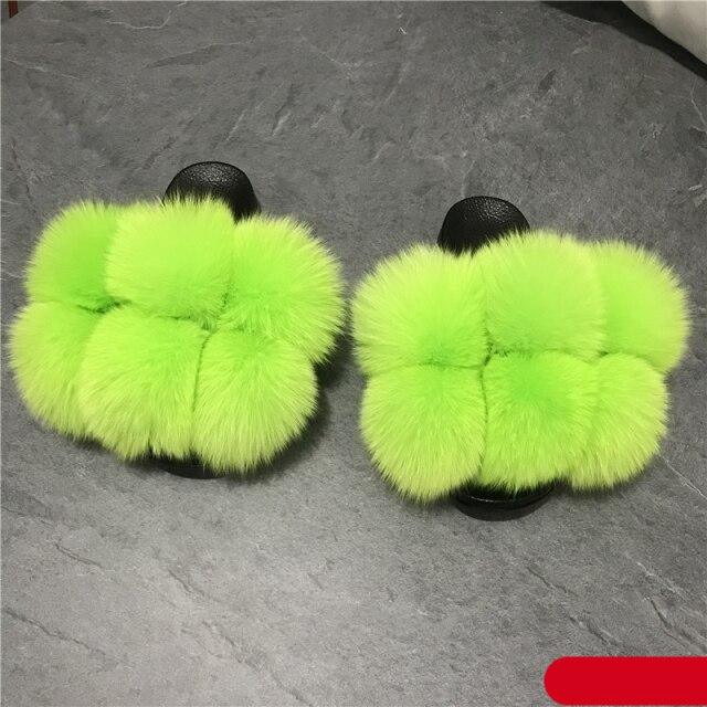 Women fluffy faux fur slippers neon lime green pair with black soles on Tampa Home & Garden Store