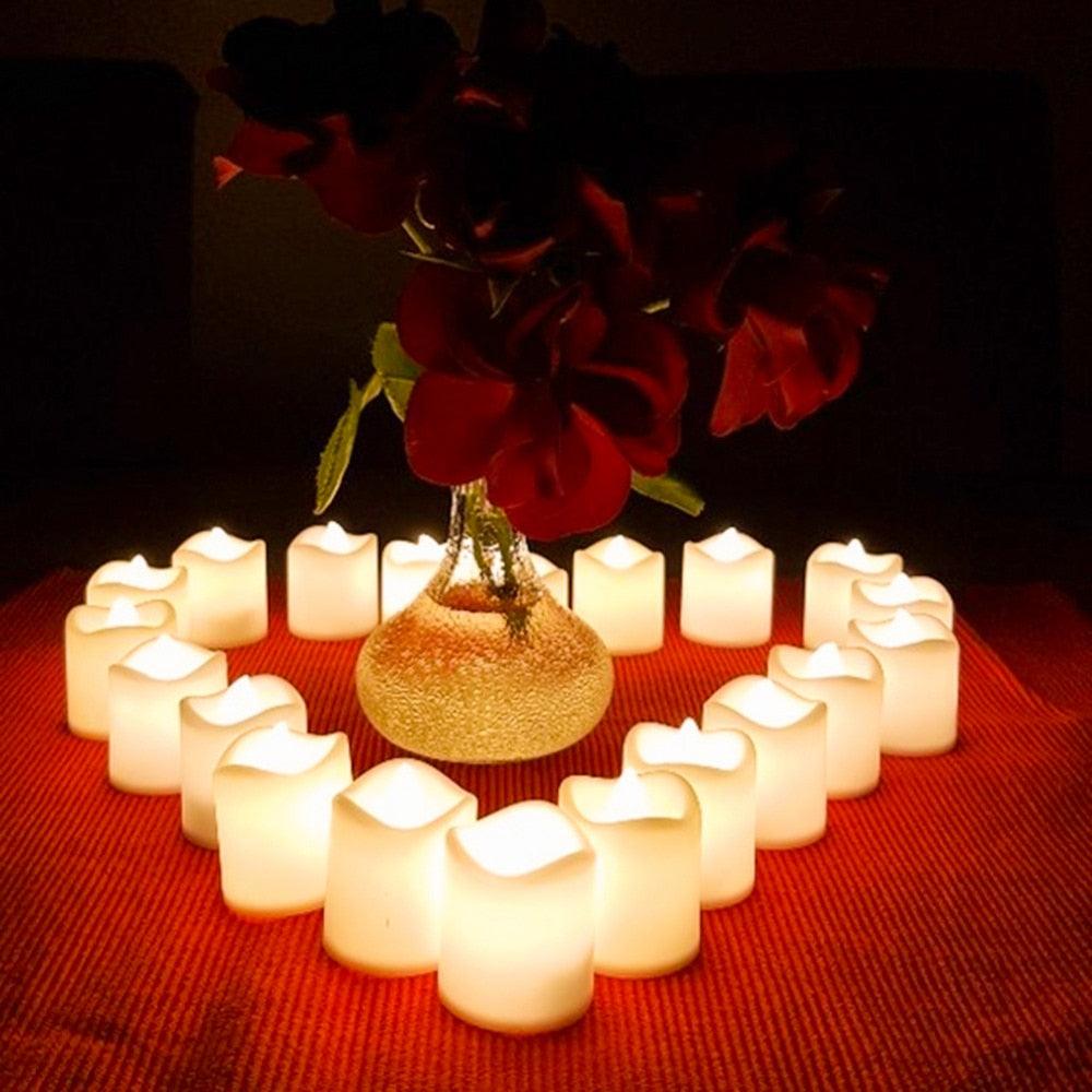 Stevvex flameless LED tea lights 24-pack, warm white flickering candles around a glass vase on Tampa Home & Garden Store