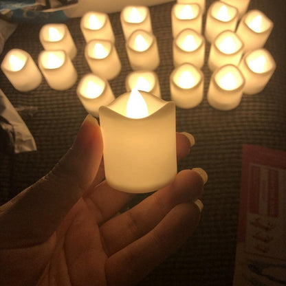 Stevvex flameless LED tea light candle warm flicker battery powered 12/24-pack set in hand on Tampa Home & Garden Store