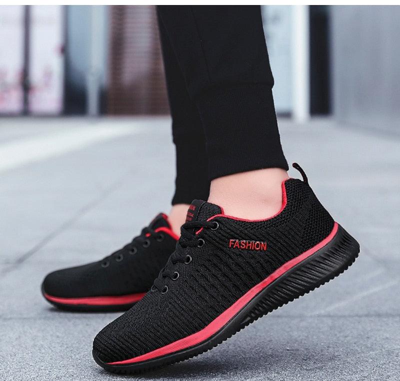 Mens black mesh running sneakers pair with red trim, breathable casual walking shoes on Tampa Home & Garden Store