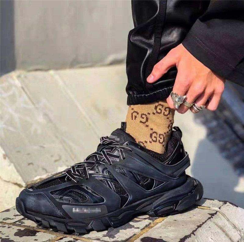 Black women's breathable mesh sneakers with chunky sole on steps near street on Tampa Home & Garden Store