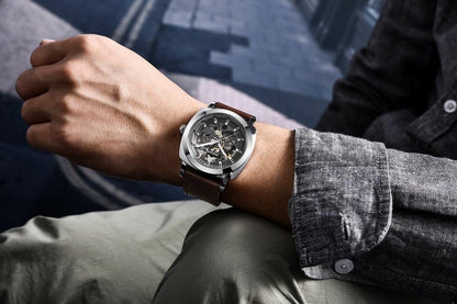 Stevvex skeleton mechanical watch with silver case and brown leather strap on wrist on Tampa Home & Garden Store