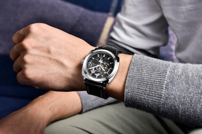 Stevvex skeleton automatic watch for men with silver case and black leather strap on wrist on Tampa Home & Garden Store