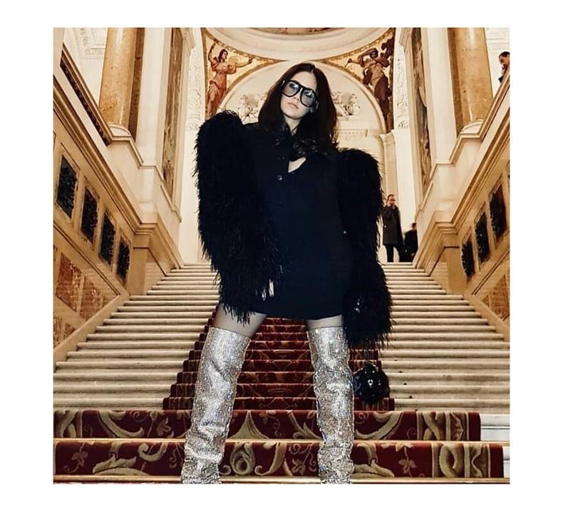 Round sunglasses with oversized black frames worn by a model in a black fur coat on Tampa Home & Garden Store