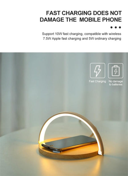 Stevvex wireless charging LED desk lamp with wooden arc and white ring, phone on base on Tampa Home & Garden Store