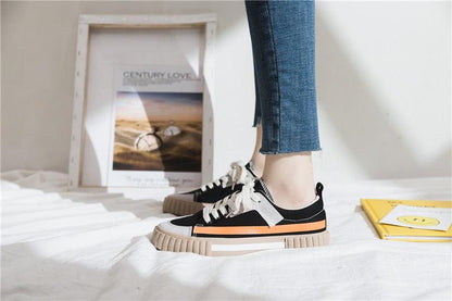 Womens Stevvex canvas sneakers, black low-cut vulcanized flats with toe cap and orange stripe on Tampa Home & Garden Store