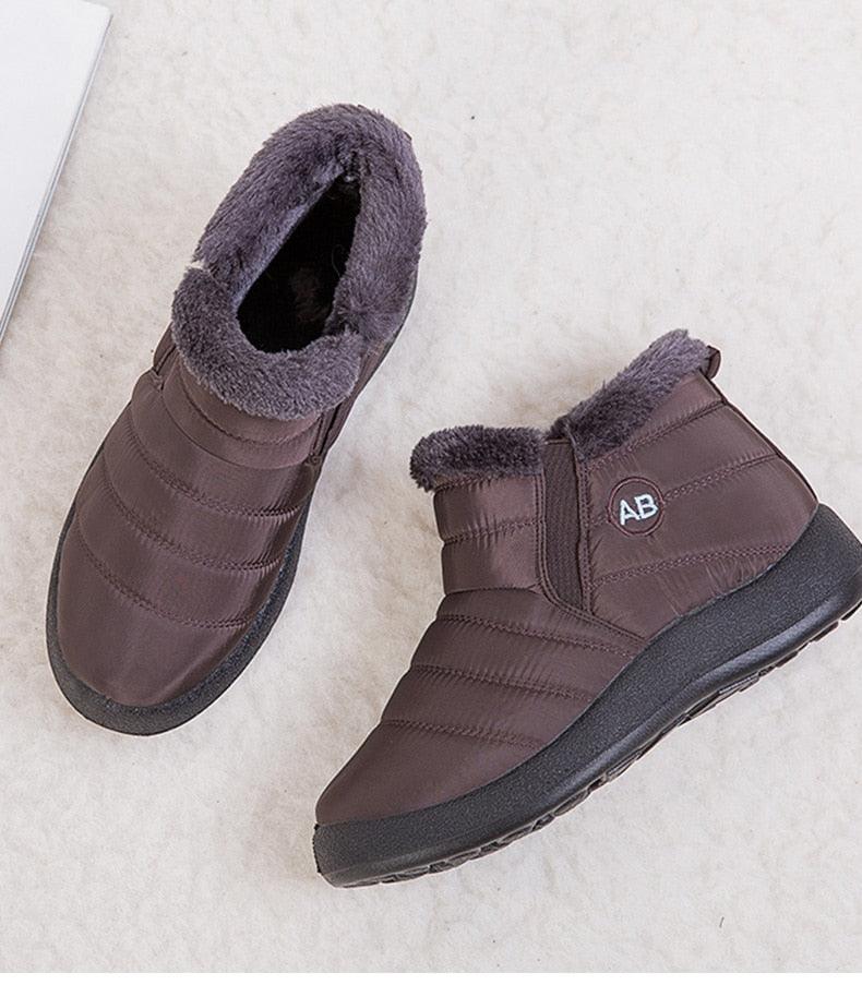 Brown women's waterproof snow boots with fur lining, padded ankle height, AB logo on Tampa Home & Garden Store