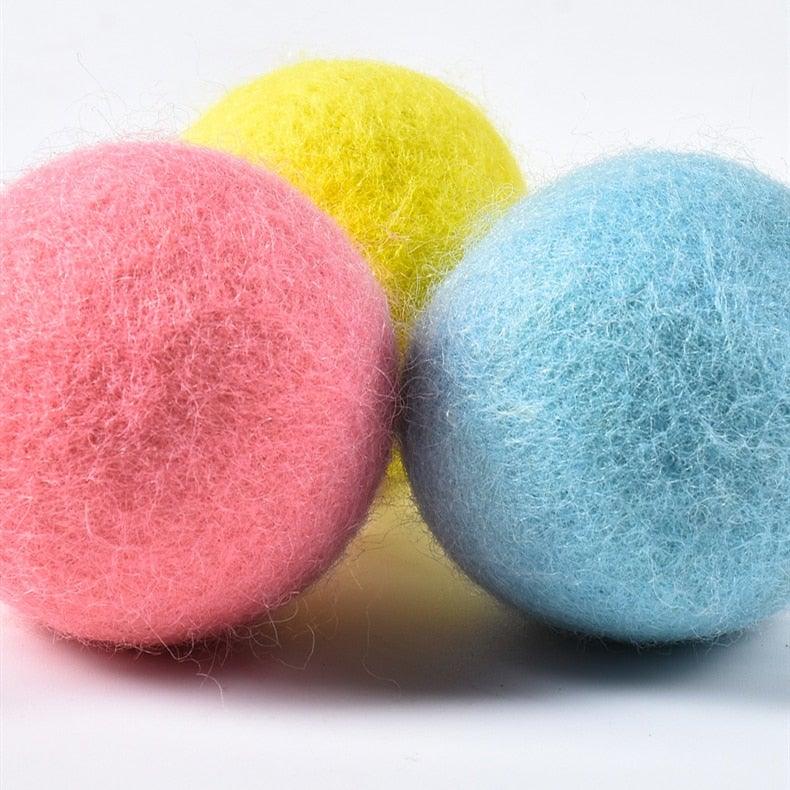 Fluffy felt cat ball toys in pink, yellow, blue; catnip balls for play and exercise on Tampa Home & Garden Store