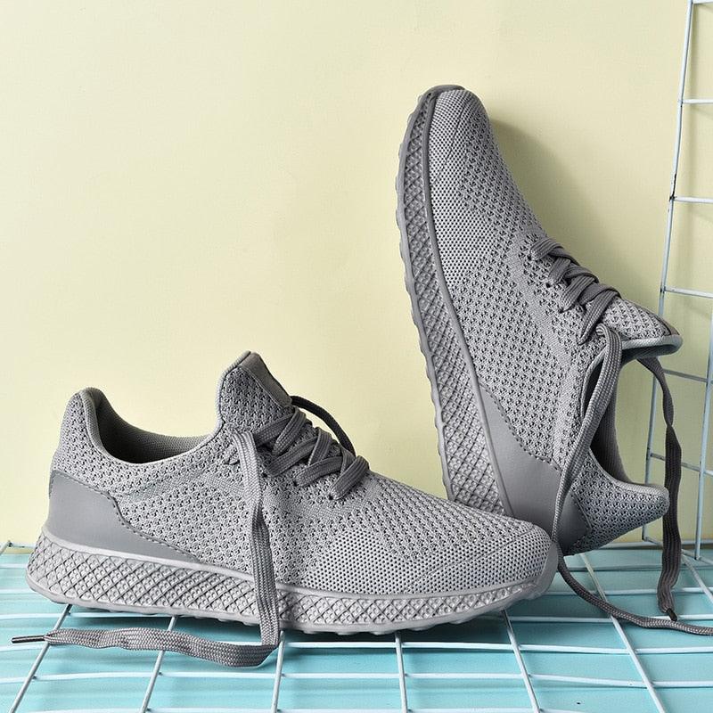 Men's Stevvex sneakers with grey breathable mesh upper, lace-up, athletic running style on Tampa Home & Garden Store