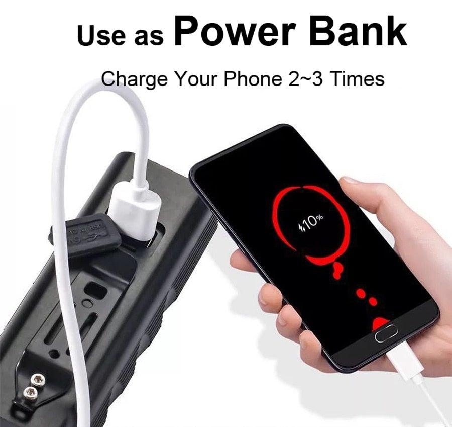 Power bank charges smartphone via USB cable; black battery pack with white USB connector on Tampa Home & Garden Store