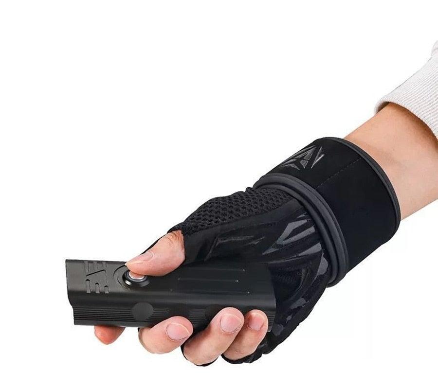 Bike light Stevvex USB rechargeable handheld front headlight in black held by gloved hand on Tampa Home & Garden Store