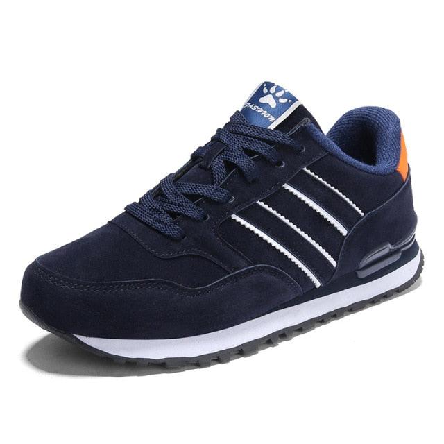 Blue Stevvex men's casual sneakers with navy artificial leather upper and white side stripes on Tampa Home & Garden Store