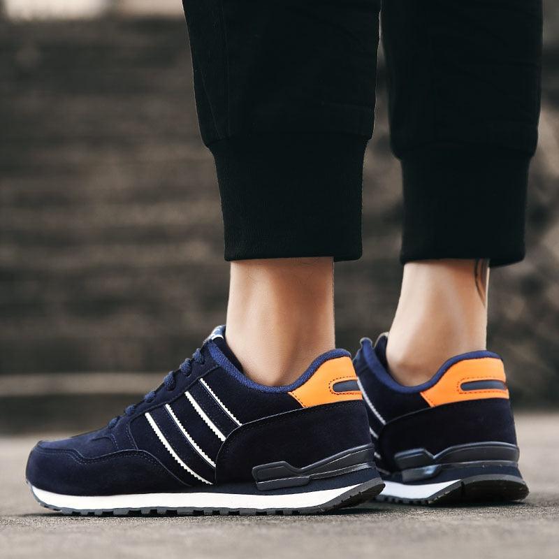 Sneakers Stevvex blue artificial leather pair with white stripes and orange heel tab on Tampa Home & Garden Store