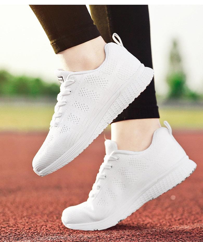 Stevvex women's white mesh casual sneakers, breathable lightweight walking shoes, pair on Tampa Home & Garden Store