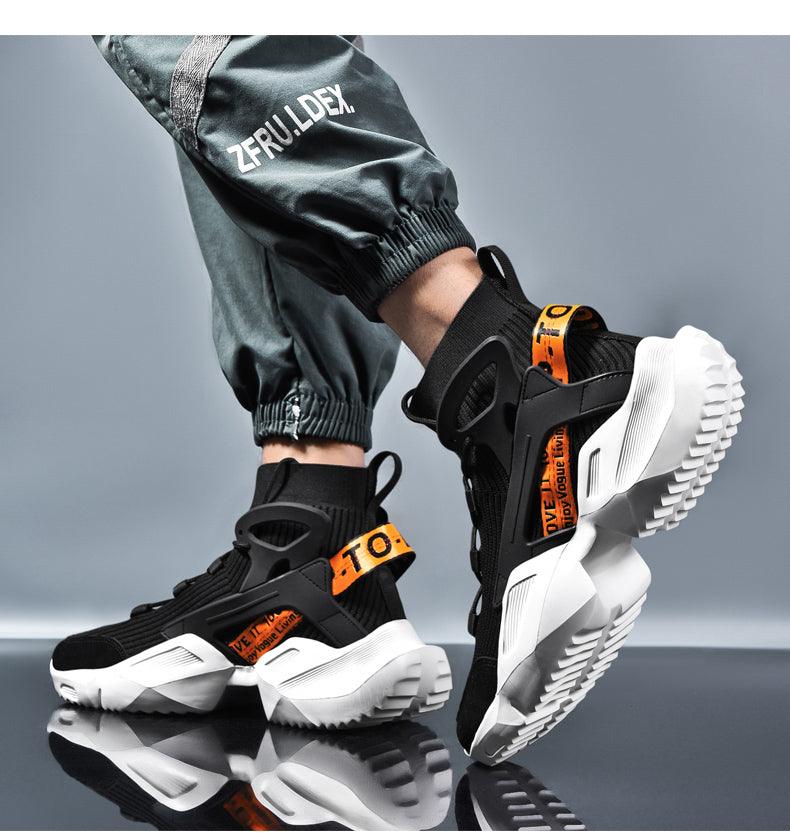 Mens high-top fashion sneakers in black mesh with white chunky sole and orange pull tabs on Tampa Home & Garden Store